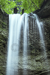 瀑布池塘旅游荒野鹅卵石峡谷溪流绿色森林石头观光图片