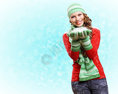 穿着温暖毛衣的年轻妇女雪花帽子头发化妆品女性衣服成人青少年手套眼睛图片