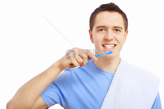 在家刷牙的年轻人头发男性幸福情绪牙膏刷子女孩牙科男人金发图片