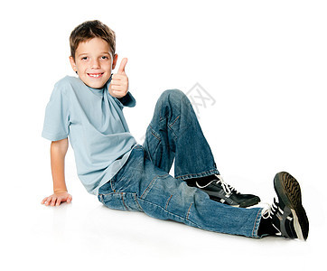 微笑的男孩牛仔裤蓝色喜悦地面男性成人孩子童年白色幸福图片