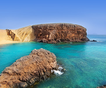 Canaries的海滩闲暇海岸线旅行胰岛场景娱乐蓝色岩石地标海浪图片