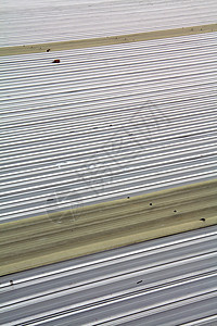 以钢铁制成的屋顶床单涟漪建造蓝色金属技术盘子波纹瓦楞边界图片