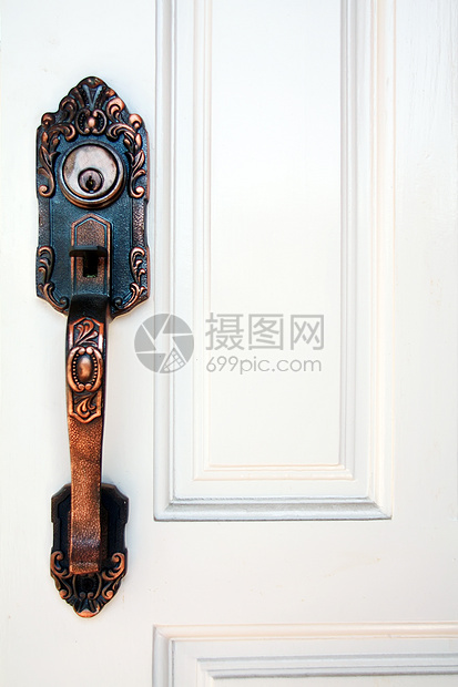白色门上的钥匙孔大门古董闩锁房子宏观建筑学隐私木头入口安全出口图片