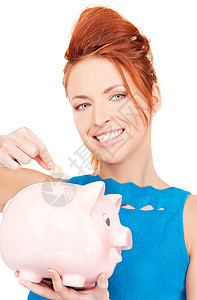 可爱的有小猪银行的女人成人经济女性现金金融微笑女孩快乐投资蓝色图片