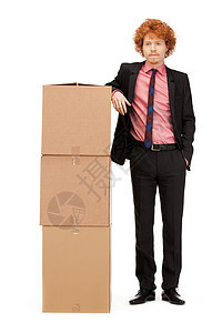 拥有大箱子的有吸引力的商务人士服务男人生意纸板船运工人纸盒企业家男性销售量图片