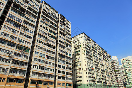 香港拥挤的大楼多层高楼建筑学窗帘城市生活住宅财产不动产百叶窗图片