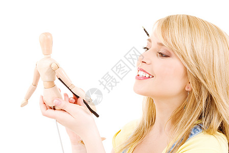 快乐的少女女孩与木模假木模特快乐铅笔女性玩具人体金发女郎棕色艺术家眼睛数字图片