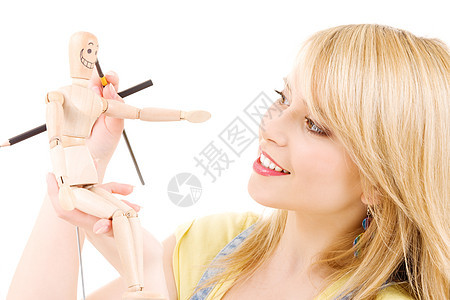 快乐的少女女孩与木模假木模特棕色木偶娃娃解剖学模型艺术快乐眼睛人体青少年图片