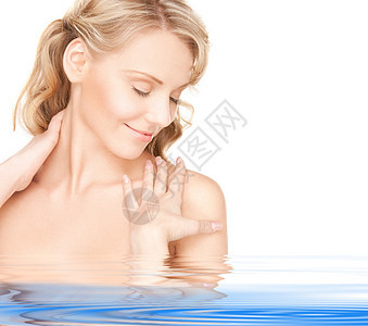 美丽美丽的妇女蓝色青年温泉微笑福利皮肤护理头发女性容貌图片