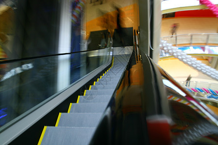 模糊的扶梯玻璃商业金属地面蓝色通道自动扶梯中心天花板购物中心图片