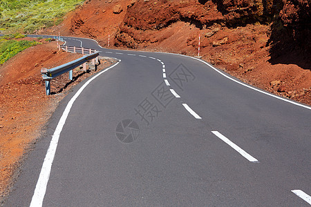 加那利群岛山上弯曲道路曲线石头旅游土壤国家岛屿公园缠绕线条干旱土地图片