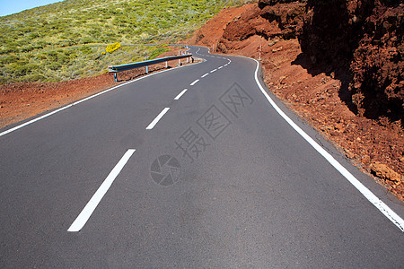 加那利群岛山上弯曲道路曲线干旱土壤土地线条缠绕旅行火山公园旅游岛屿图片