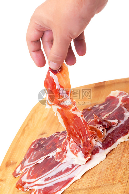 薄薄的西班牙Jamon 用一只手午餐猪肉木板小吃塔帕白色切割美食营养食物图片