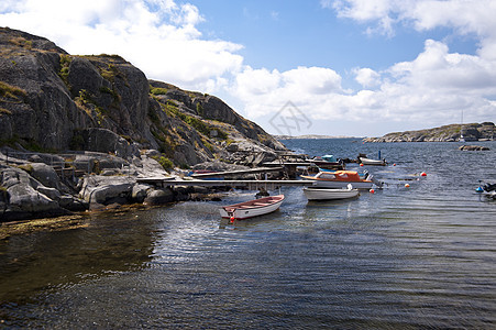 瑞典哈韦克斯特兰花岗岩岩石岛屿天空旅行村庄渔船小屋蓝色船屋图片