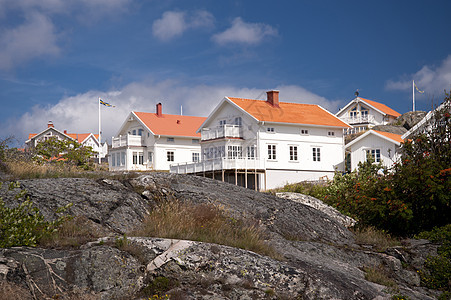 瑞典哈韦克斯特兰小岛岩石蓝色建筑荒地房屋旅行树木花岗岩天空图片