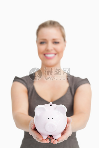 女人展示一小猪银行金发女郎阶层秘书白领粉色人士女士手掌存钱罐头发图片