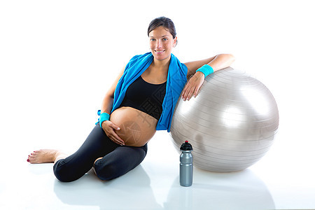 健身健身房的美丽孕妇放松了成人女士肚子母性怀孕瑜伽女性有氧运动妈妈毛巾图片