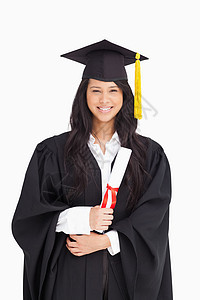 身着毕业礼服的有学位的女性妇女图片