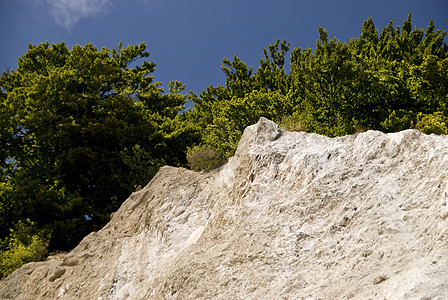 德国鲁根岛卵石白色打火石岩石白垩悬崖景观蓝色燧石石头图片