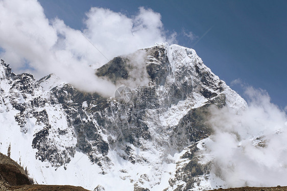 雪雪山岩石全景爬坡蓝色高山环境天空旅行风景活动图片