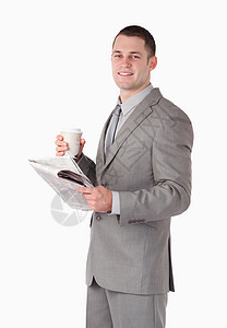 拿着报纸和一杯茶的商务人士的画像图片