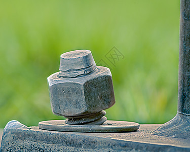 拉格博尔特 努特和瓦瑟工业崎岖水泥弯曲金属宏观纹理坚果紧固件垫圈图片