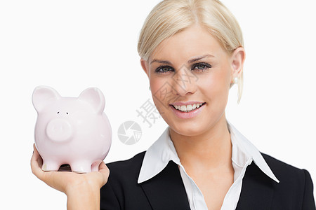 拥有小猪银行的笑脸女商务人士秘书套装存钱罐粉色浅色配售商务储蓄头发金发图片