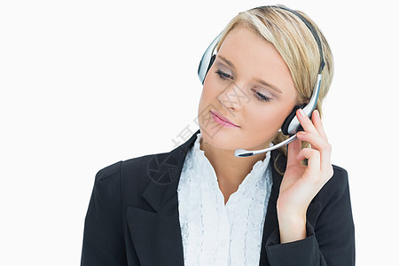 戴耳机的妇女互动浅色客户操作员人士呼叫微笑长发金发女郎女性图片
