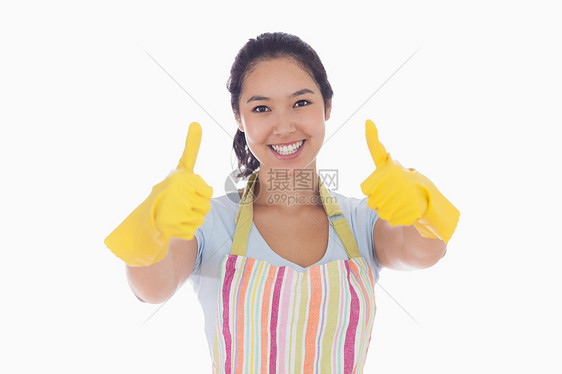 戴橡胶手套的妇女举起拇指图片
