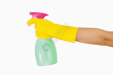 妇女戴黄色橡胶手套 手持窗户清洁剂图片