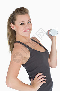 妇女举起哑铃头发身体重量女士运动服锻炼女性眼睛举重浅色图片