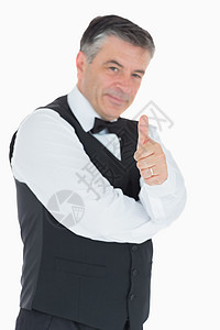男人举起大拇指棕色衬衫奢华头发套装男性制服服务微笑领结图片