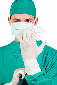 身戴外科手术手套的严重外科医生图片
