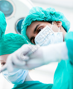 手术期间的重症外科医生 医疗概念病人医院操作女性诊所护士面具药品疾病情况图片