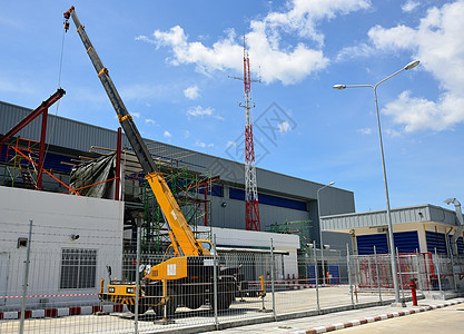 起重机建造工业黄色建筑车辆机器脚手架金属天空液压图片