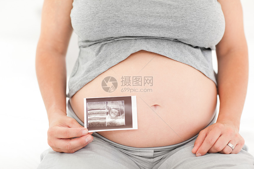 带X光照的孕妇靴子白色沙发婴儿妈妈怀孕长椅女性卧室女士图片