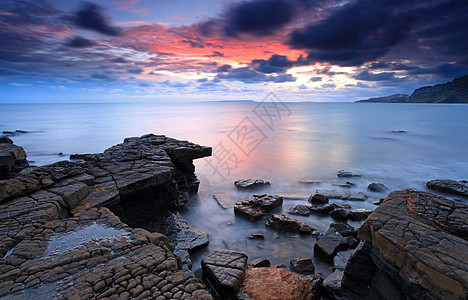 海湾海岸蓝色海浪日落风景侏罗纪海滩海洋天空目的地图片