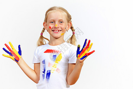 手上涂着油漆的幸福的孩子女孩童年指纹乐趣艺术教育艺术家绘画幼儿园工艺图片