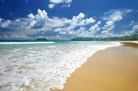 海滩天空热带海岸线蓝色海洋假期风景黄色地平线海景图片