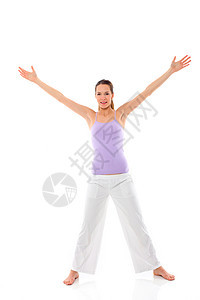年轻女子在白背景演播室做瑜伽年轻人背心体操微笑双臂娱乐赤脚器材成人女性图片