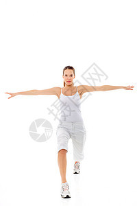 年轻女子在白背景演播室做体操运动运动装器材年轻人练习运动鞋女性女士双臂娱乐图片