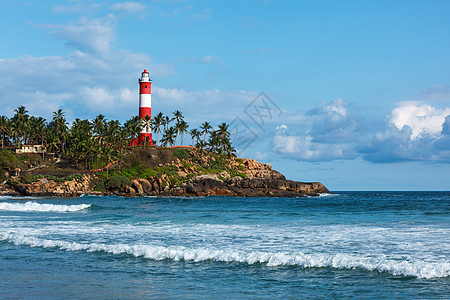 KovalamVizhinjam灯塔 印度喀拉拉波浪天气海景岩石风暴棕榈海洋图片