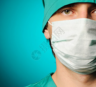 外科医生绿色外套医疗男人面具蓝色保健卫生从业者男性图片