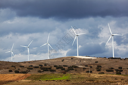 西班牙布尔戈斯省风力发电机多云活力生态绿色太阳图片