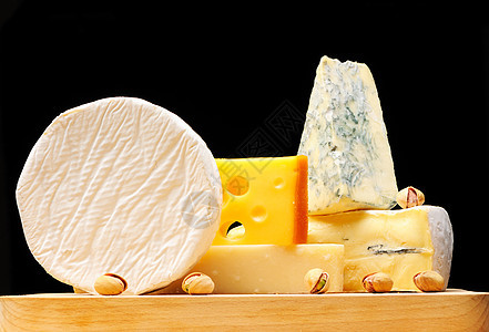 各种奶酪种类蓝色白色模具开心果小吃羊乳产品黄色食物奶制品图片