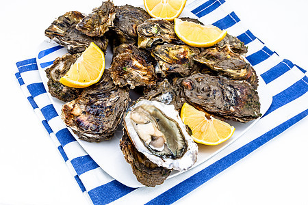 牡蛎海洋贝类盘子贝壳奢华柠檬海鲜午餐壳类熟食图片