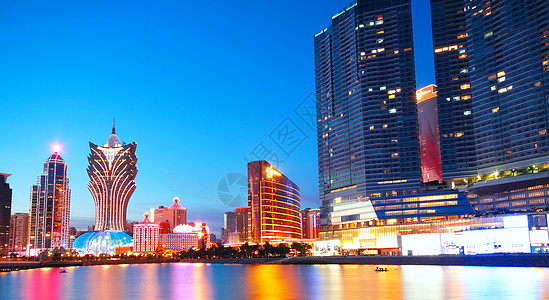 亚洲澳门桥和摩天大楼的澳门城市景象港口建筑景观戏剧性地标旅行日落反射市中心公寓图片