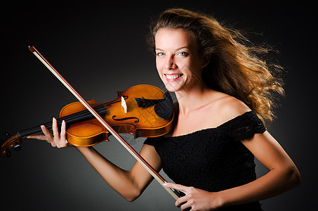 在暗房里拉小提琴的女人中提琴提琴手女士作品音乐会交响乐音乐家协奏曲乐队女性图片