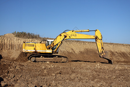 挖掘机黄色液压机器车辆功率工业机械工作土壤推土机图片
