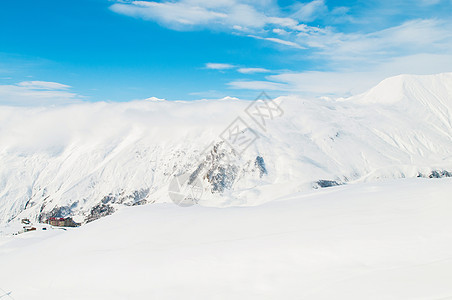 明亮的冬天天雪山天空旅行冰川风景假期滑雪全景山脉顶峰太阳图片